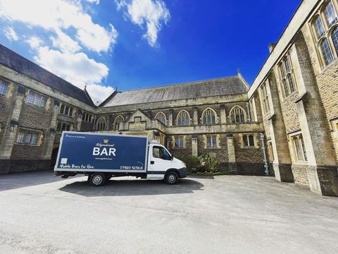 Wagonkered van parked in a courtyard